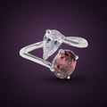 Bague Embellie argent 925, zirconium cubique ovale rose et goutte incolore sur deux branches croisées, sur fond aubergine