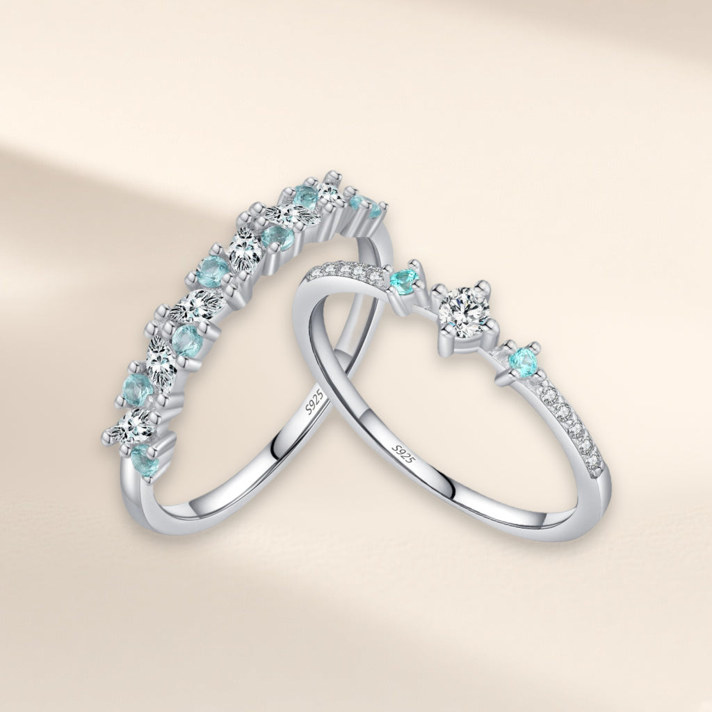 Bague Menthe à l'Eau, les deux modèles : rangée alternée de pierres bleu-vert et claires, et modèle trois pierres