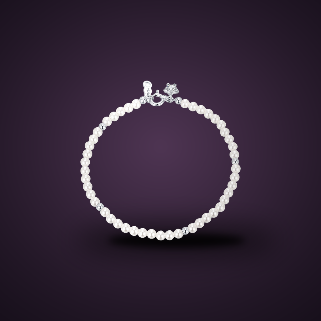 Bracelet Fil d'Étoiles argent 925 et perles d'imitation sur fond aubergine