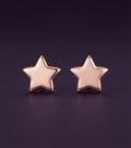 Puces Premier Ciel étoile, plaqué or rose sur argent 925, la paire sur fond aubergine